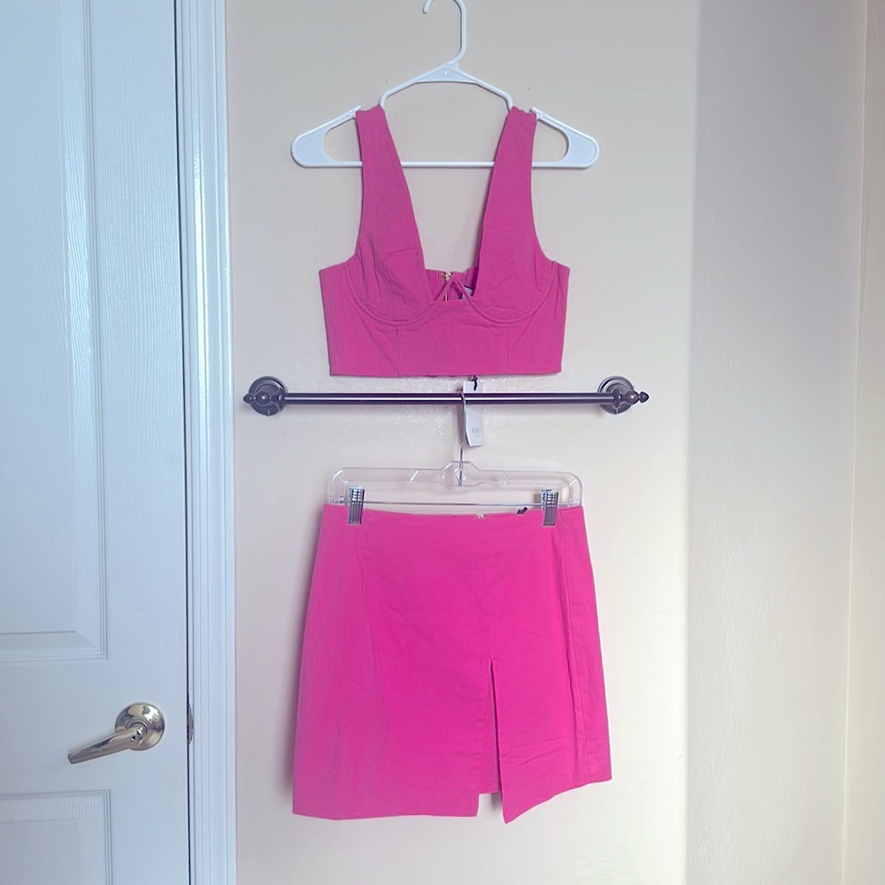 Pink two piece set. Roxy bustier crop top. Mini skirt with slit on left side.